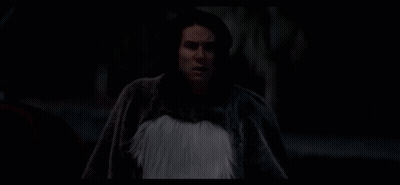 A Man In A Skeleton Shirt Is Looking At The Camera GIF