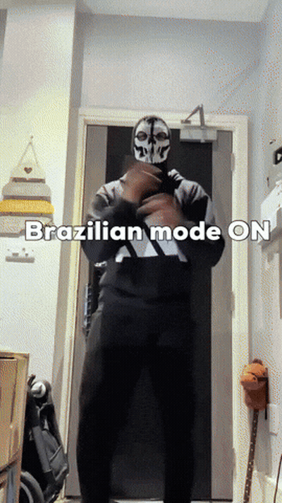 A Man In A Skull Mask Is Standing In Front Of A Door With The Words Brazilian Mode On Written Below Him GIF