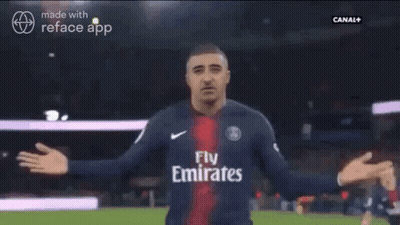 A Man In A Soccer Jersey Is Being Hugged By Another Man GIF
