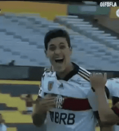 A Man In A Soccer Uniform Is Standing In A Stadium . GIF