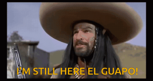 A Man In A Sombrero Is Holding A Gun And Says I 'M Still Here El Guapo GIF