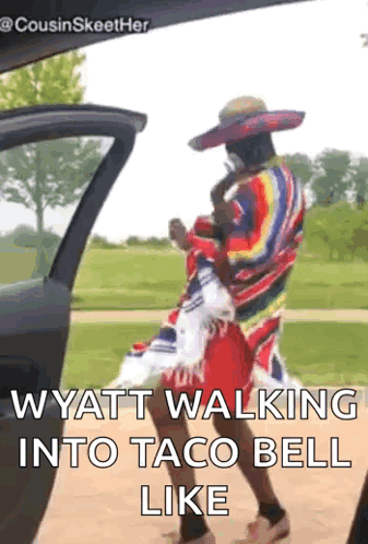 A Man In A Sombrero Is Walking Into A Taco Bell Like . GIF
