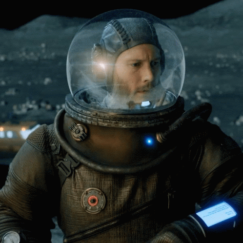 A Man In A Space Suit Has A Watch On His Wrist That Says ' I 'M Sorry ' On It GIF