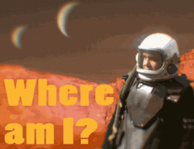 A Man In A Space Suit Is Standing In Front Of A Poster That Says Where Am I GIF