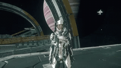 A Man In A Space Suit Is Standing On A Planet GIF