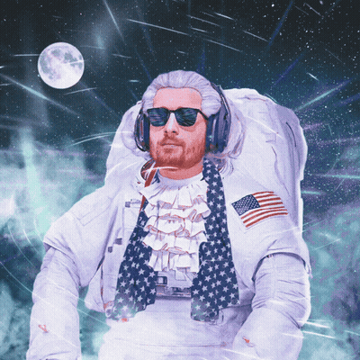A Man In A Space Suit Is Wearing A Wig And Sunglasses GIF