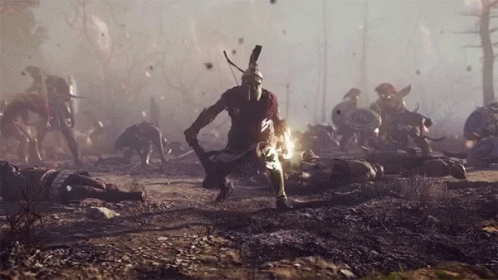 A Man In A Spartan Helmet Holds A Sword In A Battle Scene GIF