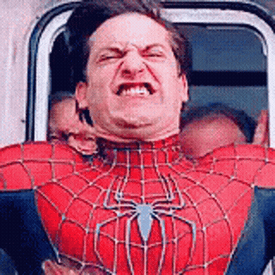 A Man In A Spider Man Costume Is Making A Funny Face . GIF