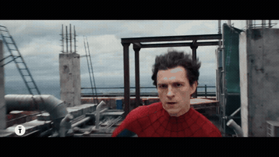A Man In A Spider Man Costume Is Standing On A Rooftop GIF