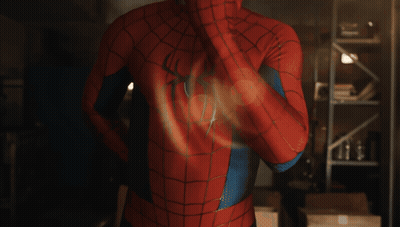 A Man In A Spiderman Costume Has A Spider On His Chest GIF