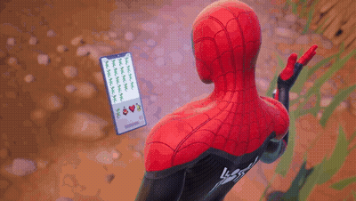 A Man In A Spiderman Costume Holds A Cell Phone GIF