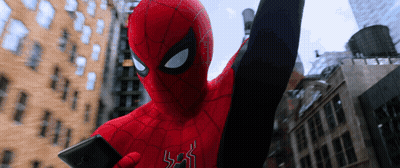 A Man In A Spiderman Costume Is Holding A Phone GIF