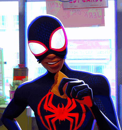 A Man In A Spiderman Costume Is Holding A Piece Of Food GIF