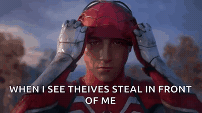 A Man In A Spiderman Costume Is Holding His Helmet Over His Head . GIF