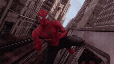 A Man In A Spiderman Costume Is Riding A Subway GIF