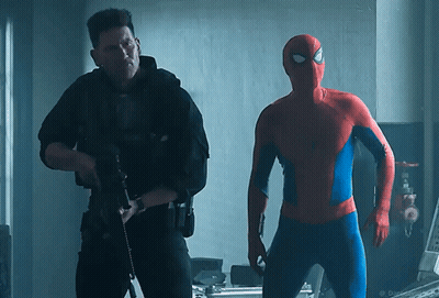 A Man In A Spiderman Costume Is Standing Next To A Man In A Black Uniform GIF