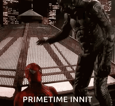 A Man In A Spiderman Costume Is Standing Next To Another Man In A Spiderman Costume . GIF