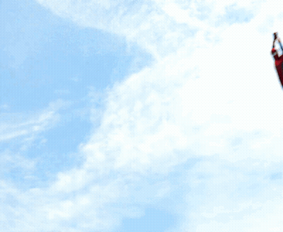 A Man In A Spiderman Costume Is Standing On A Roof GIF