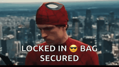 A Man In A Spiderman Costume With The Words Locked In Bag Secured Written Below Him GIF