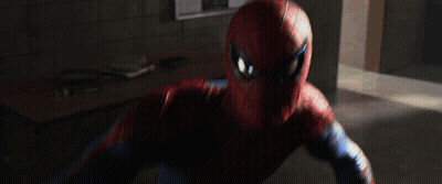A Man In A Spiderman Suit Is Fighting A Monster In A Hallway GIF