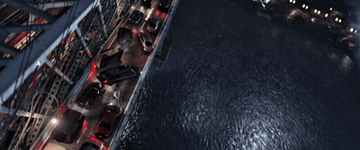 A Man In A Spiderman Suit Is Flying Over A City GIF
