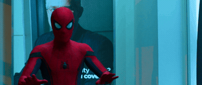A Man In A Spiderman Suit Is Standing In Front Of A Mirror That Says " I Cove " GIF