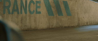 A Man In A Spiderman Suit Is Walking In Front Of A Wall That Says Rance GIF