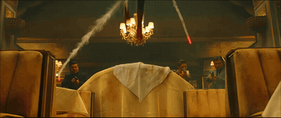 A Man In A Spiderman Suit Sits On A Couch GIF