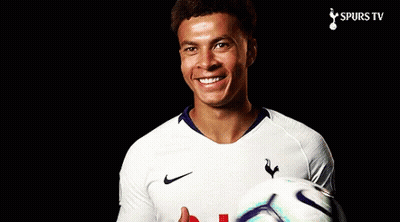 A Man In A Spurs Jersey Holds A Soccer Ball GIF
