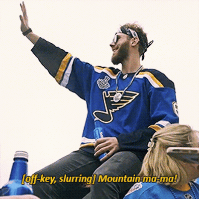 A Man In A St. Louis Blues Jersey Says Off Key Slurring Mountain Ma-Ma! GIF