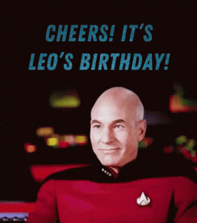 A Man In A Star Trek Uniform Is Holding A Drink And Says Cheers It 'S Leo 'S Birthday ! GIF