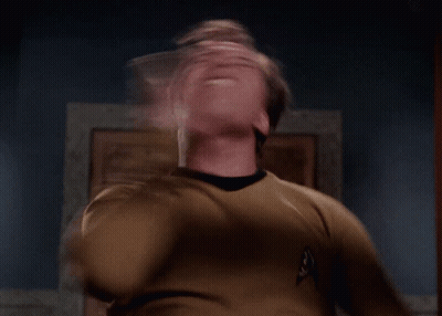 A Man In A Star Trek Uniform Is Making A Face GIF