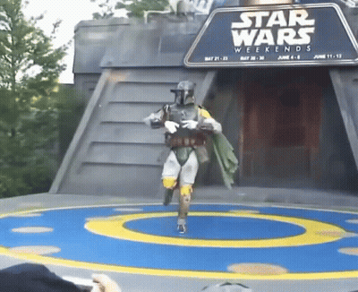 A Man In A Star Wars Costume Is Dancing On A Stage GIF