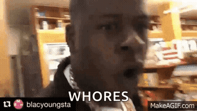 A Man In A Store With The Words Whores On The Bottom Right GIF