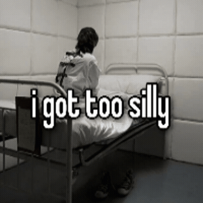A Man In A Straight Jacket Is Sitting In A Hospital Bed With The Words " I Got Too Silly " Written Above Him GIF