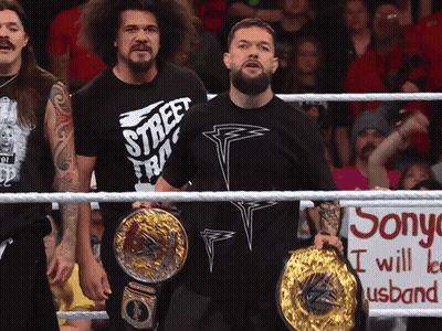 A Man In A Street Fighter Shirt Stands In A Ring GIF