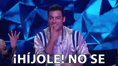 A Man In A Striped Jacket Is Sitting In Front Of A Blue Background With The Words Hijole No Se Written On It . GIF