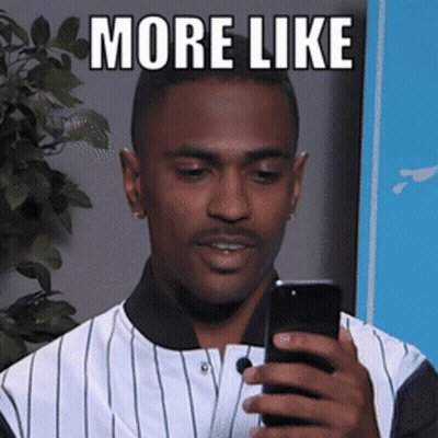 A Man In A Striped Shirt Is Holding A Cell Phone With The Words More Like Above Him GIF