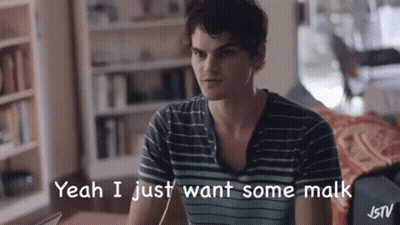 A Man In A Striped Shirt Is Sitting On A Couch And Saying Yeah I Just Want Some Malk GIF