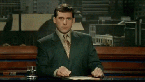 A Man In A Striped Shirt Is Standing In A Room With A Watermark That Says ' Nbc ' On It GIF