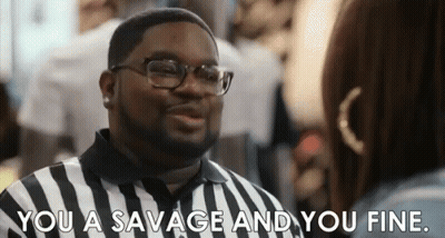 A Man In A Striped Shirt Is Talking To A Woman And Saying `` You A Savage And You Fine '' . GIF
