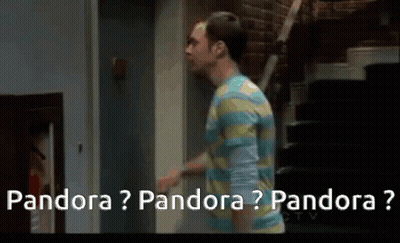A Man In A Striped Shirt Is Walking Down Stairs And Talking To Another Man . GIF