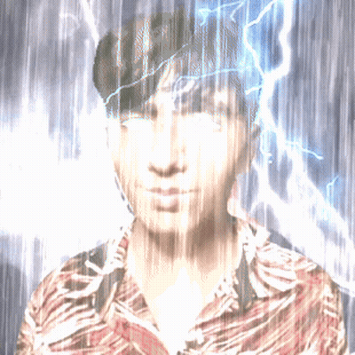 A Man In A Striped Shirt Stands In The Rain With Lightning Behind Him GIF