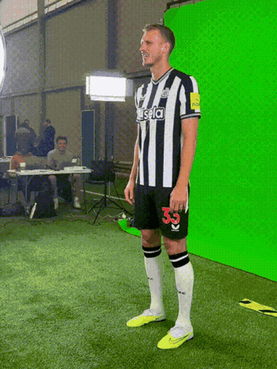 A Man In A Striped Shirt With The Number 33 On It GIF