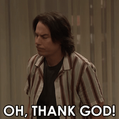 A Man In A Striped Shirt With The Words Oh Thank God Below Him GIF