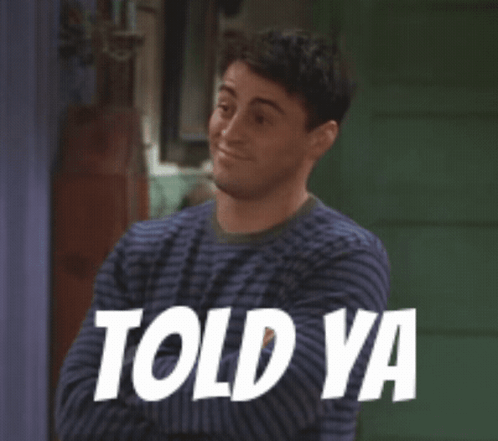 A Man In A Striped Sweater Is Smiling And Says Told Ya GIF