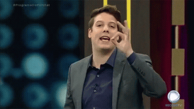 A Man In A Suit And A Blue Shirt Is On A Record Tv Show GIF