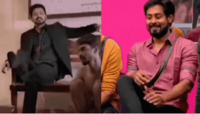 A Man In A Suit And A Man In A Pink Shirt Are Sitting On A Chair . GIF