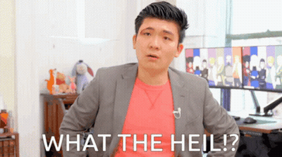 A Man In A Suit And A Pink Shirt Says What The Hell GIF
