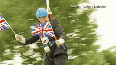 A Man In A Suit And Blue Helmet Is Holding A British Flag In A London Tonight Exclusive GIF